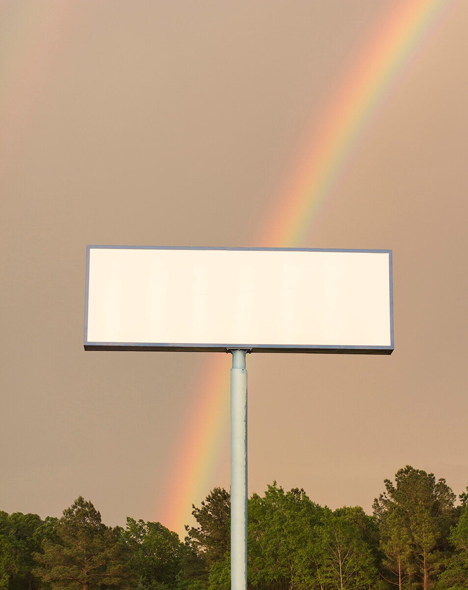 empty billboard and rainbow