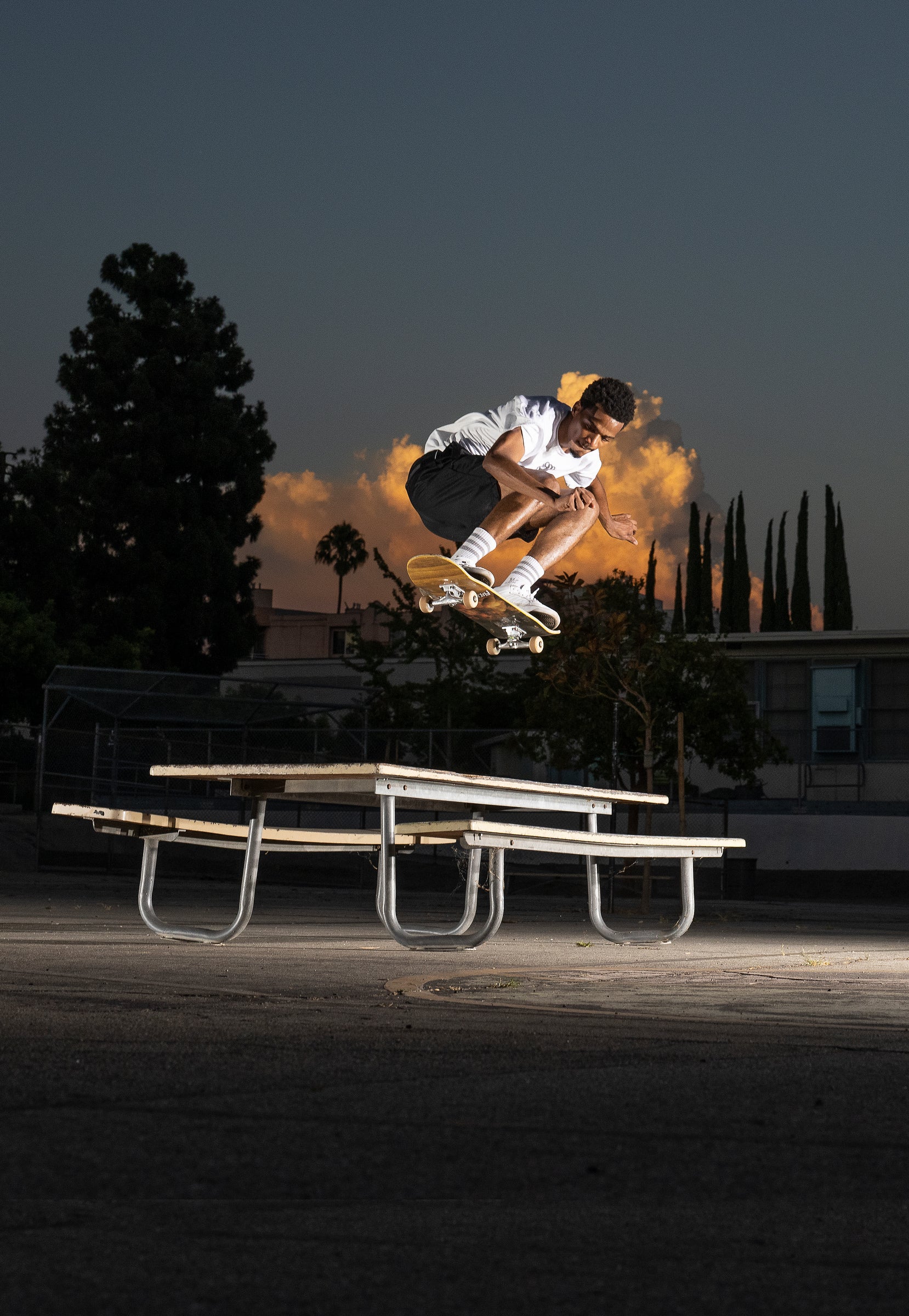 Tyshawn Jones ollies a picnic table.