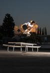 Tyshawn Jones ollies a picnic table. 