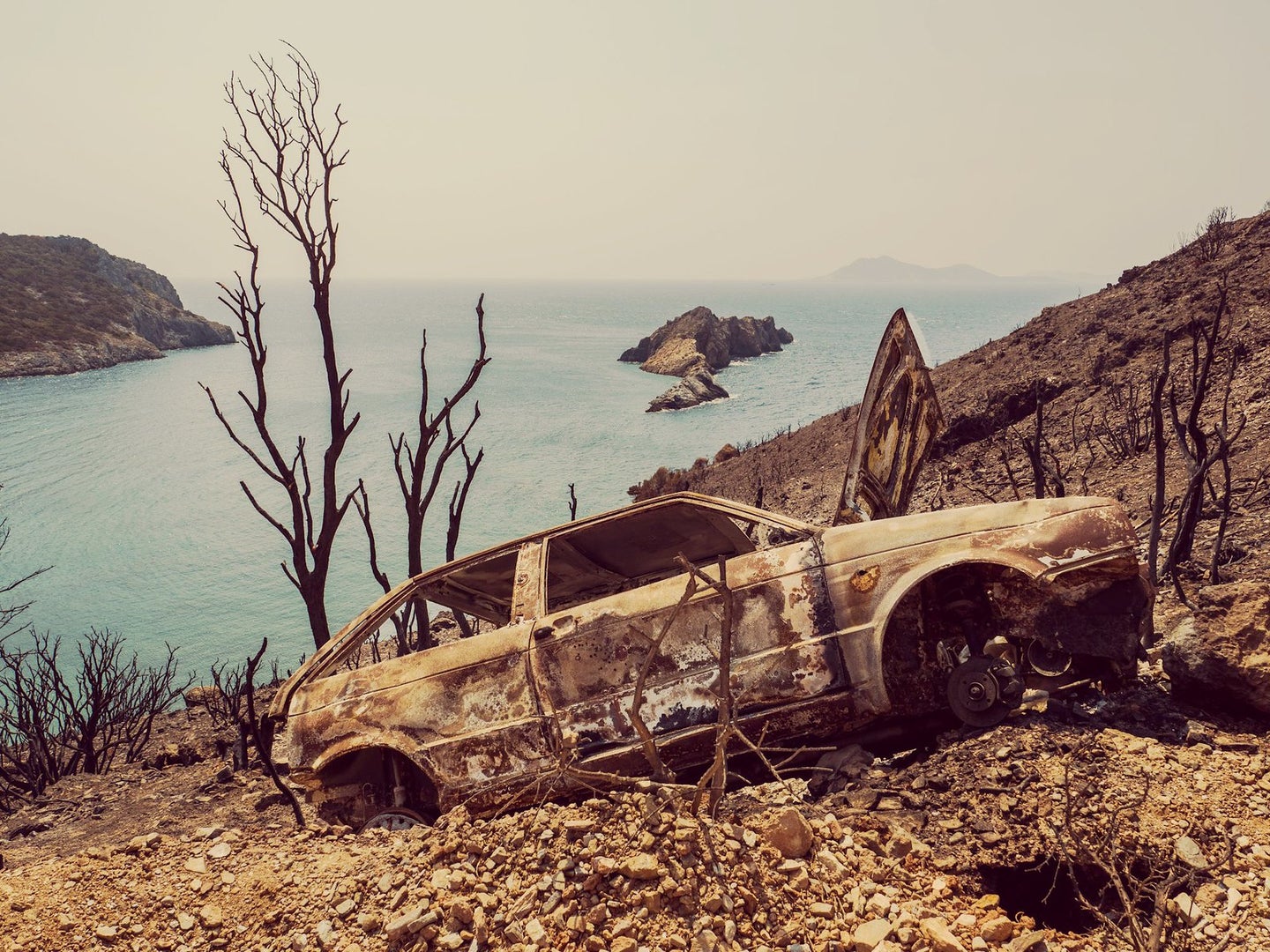 photo of the day burned car and hillside