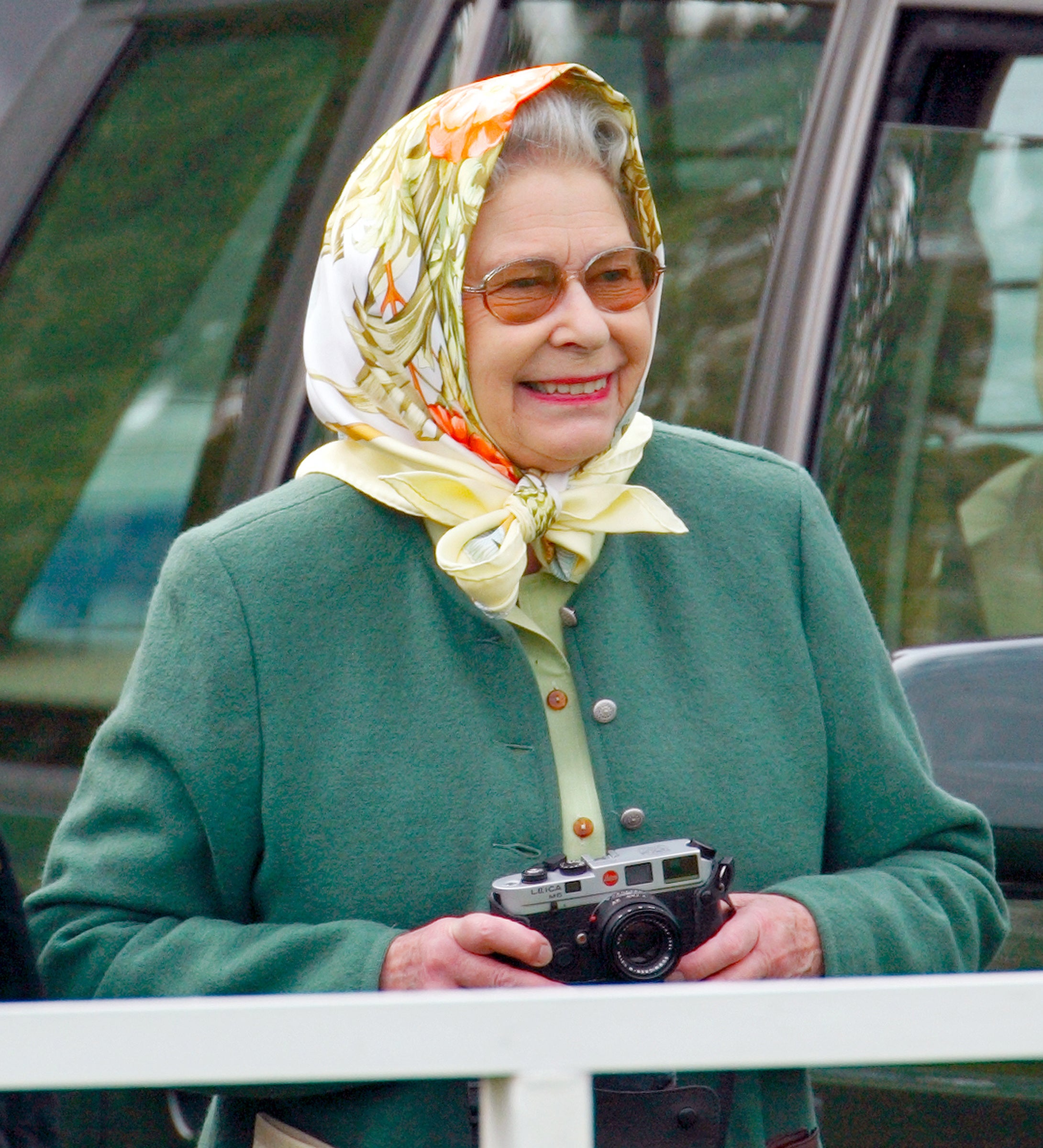 Queen Elizabeth II seen holding her Leica camera.