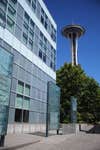 Seattle Space Needle with blue building in foreground.