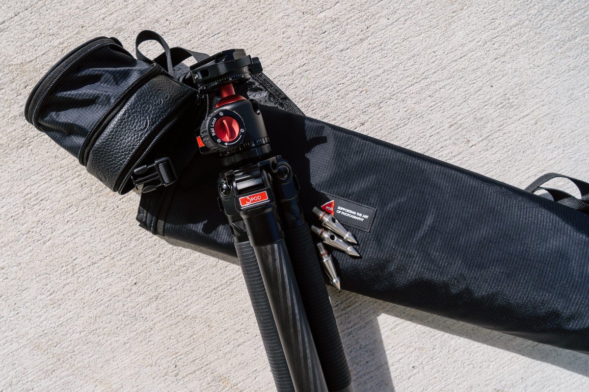 A black 3Pod Everest T5 carbon fiber tripod rests on a black carrying case.