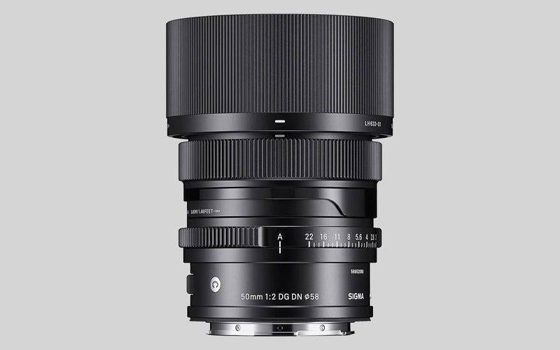 The Sigma 50mm f/2 DG DN I Series Contemporary lens on a gray background