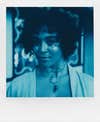 Portrait of a woman taken with Polaroid Reclaimed Blue 600 film