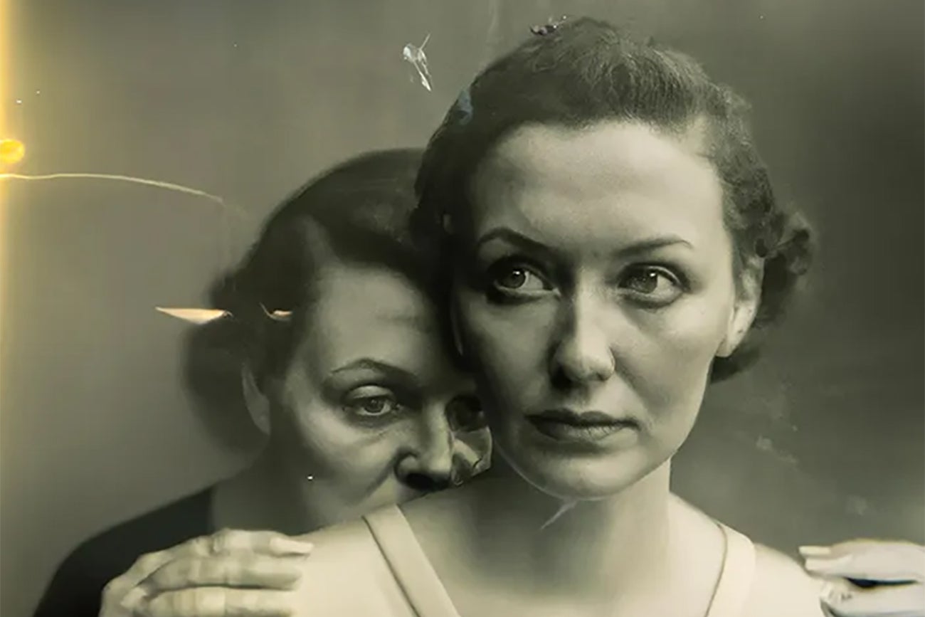 Two women posed in a tintype looking image