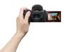 A hand holding the Sony ZV-1 II vlogging camera