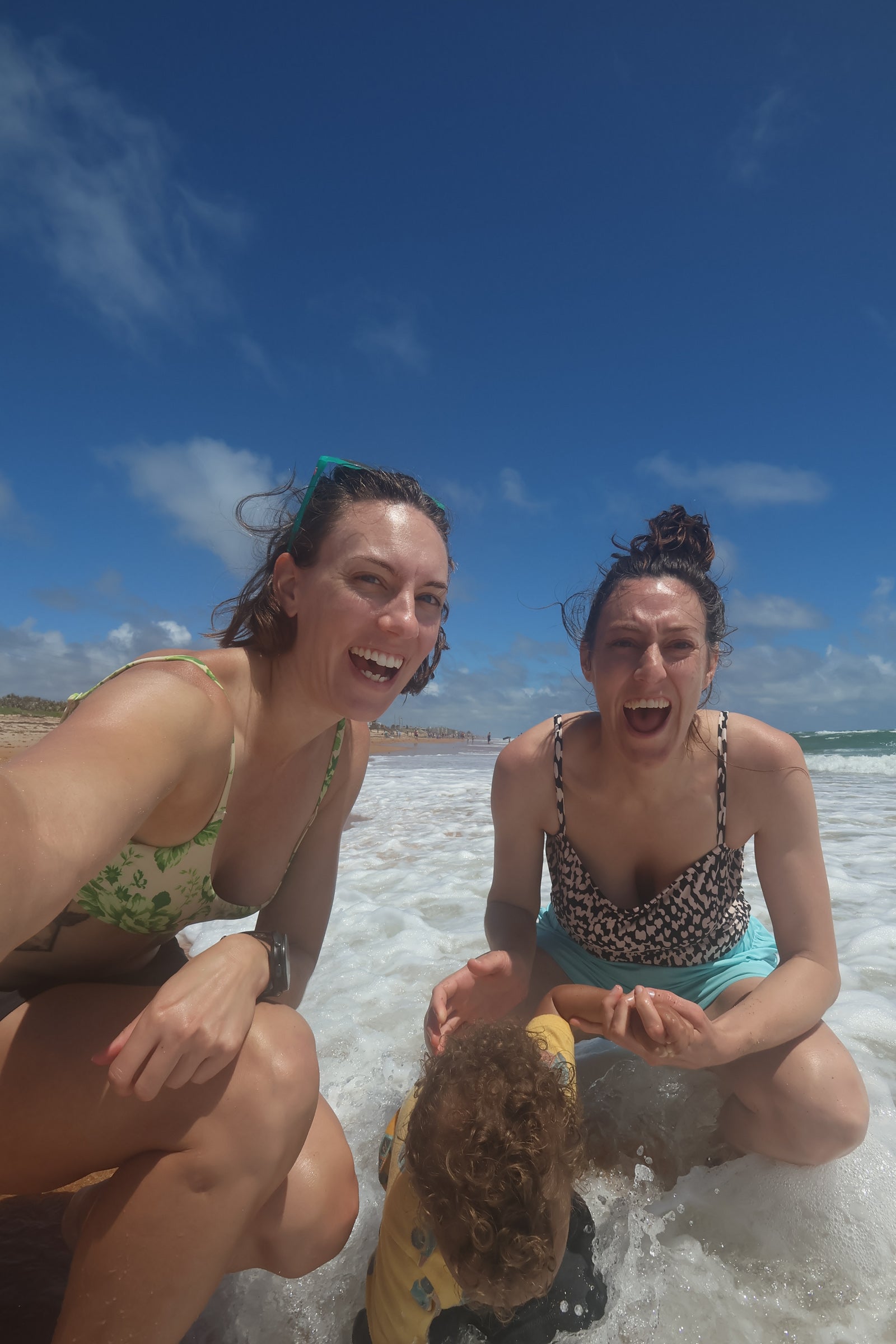 Two women and a little boy at the beach