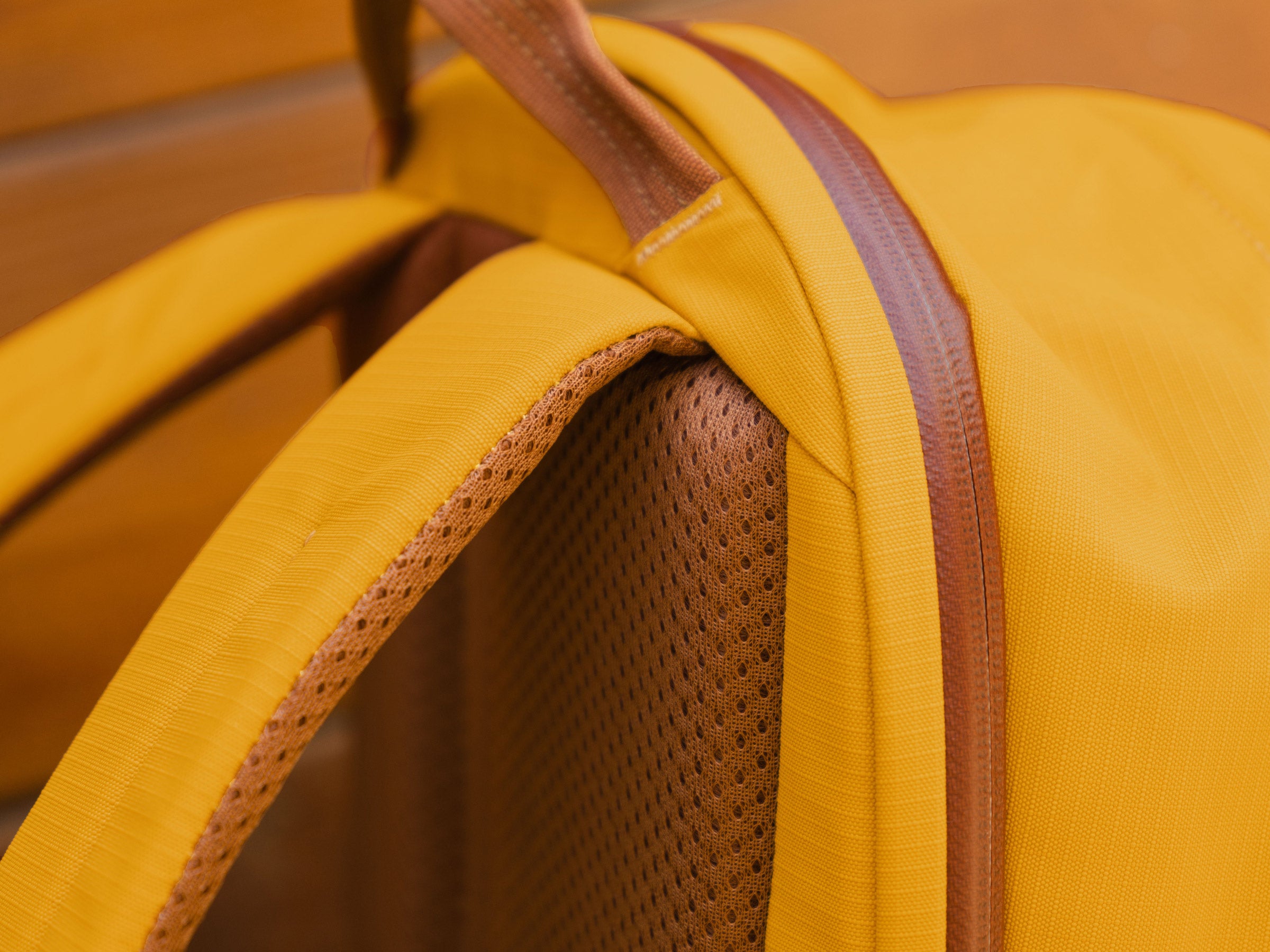 A detail of the Moment Everything backpack's padding and zipper