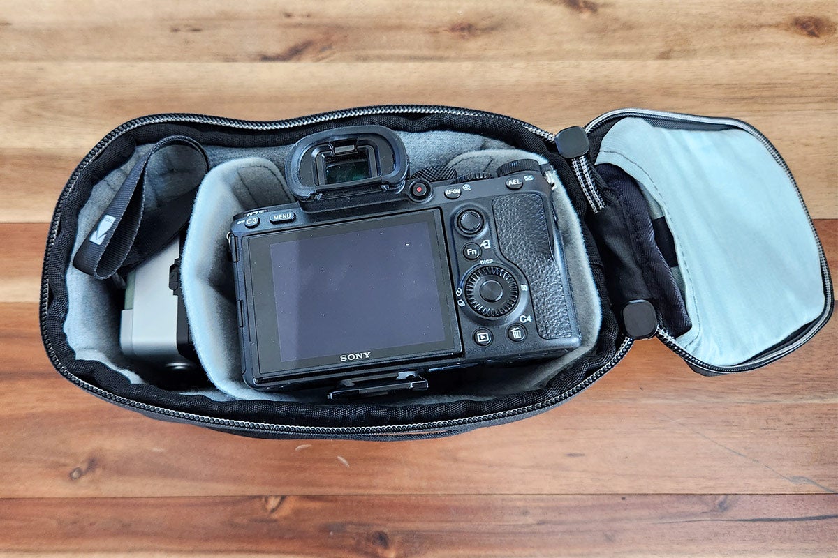 A top view of the Sony a7 III and Kodak H35 film camera placed inside a Peak Design Camera Cube V2.
