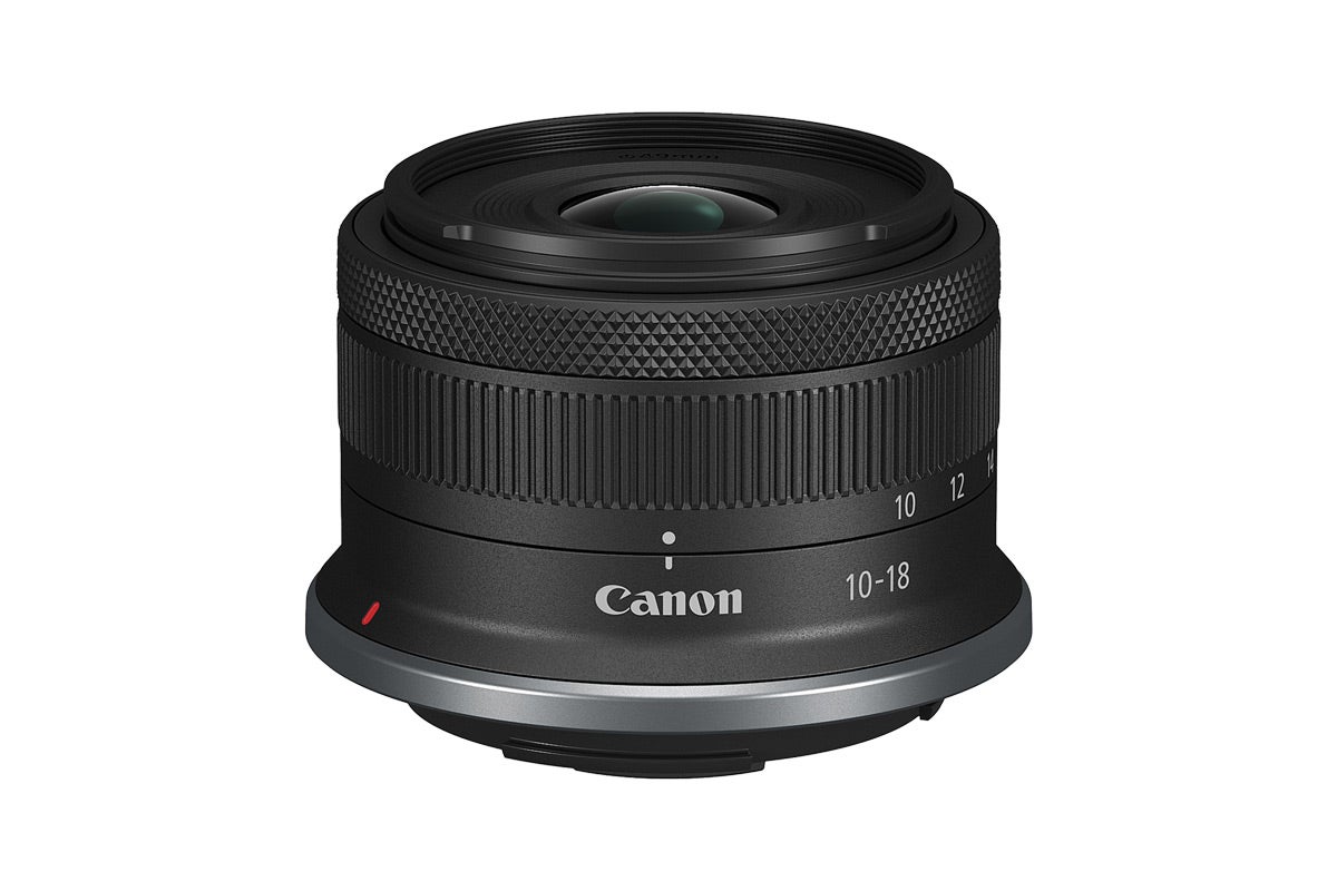 The Canon RF-S10-18mm lens is placed against a white background.